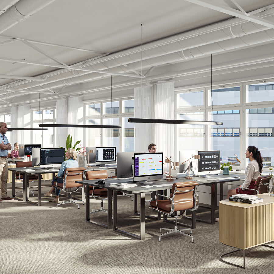 The office space on the second floor benefits from natural light through large windows.